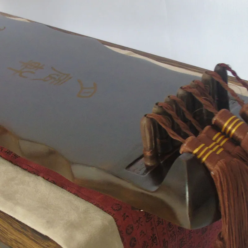 Gratis gravure 7-snarige Chine - Musical Instrument Book recensie en prijs
