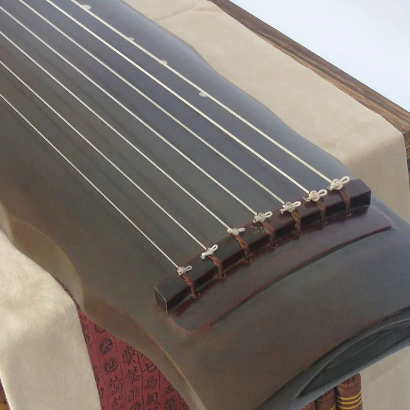 Gratis gravure 7-snarige Chine - Musical Instrument Book recensie en prijs